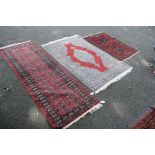 Two Pakistan rugs; together with a Pakistan Bokhara runner.