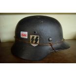 A German Third Reich 1935 pattern combat helmet, with double decal and steel camouflage strap.