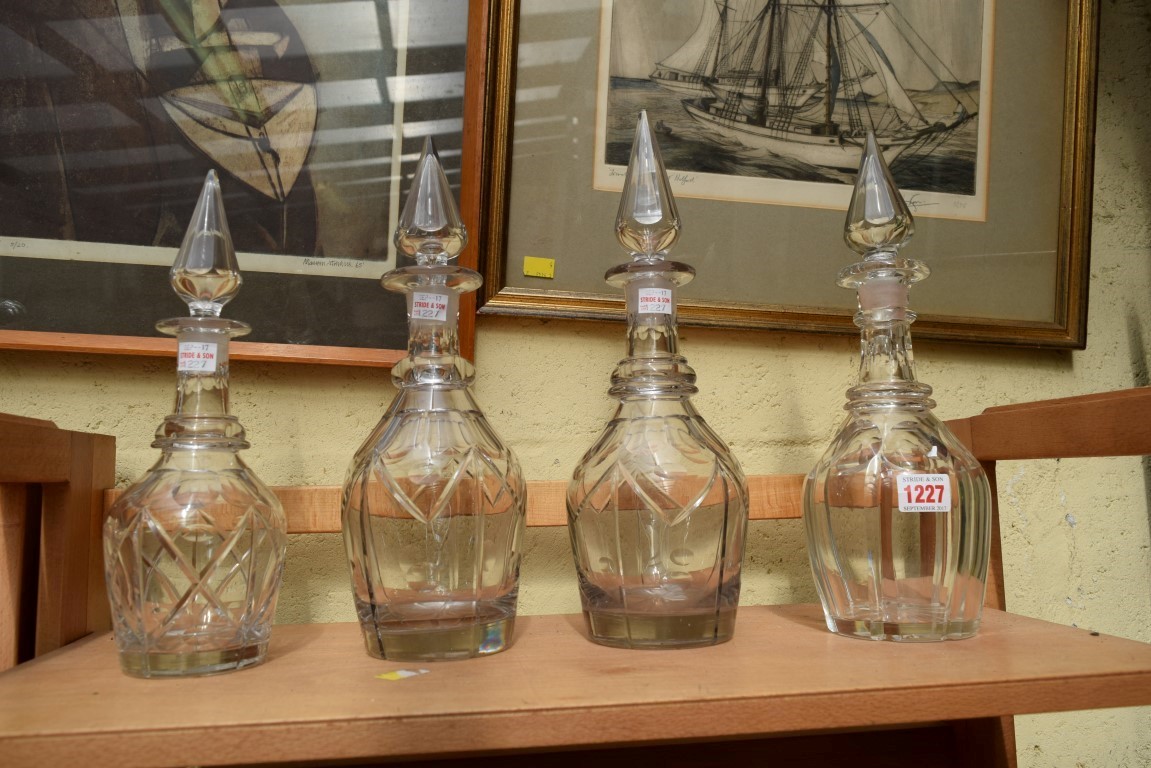 Four Victorian clear glass decanters and stoppers.