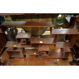 A Chinese hardwood assymetric hanging display shelf, 82cm wide..