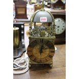 An old lantern clock, with 6in dial and anchor escapement, with pendulum, later bracket and weight,