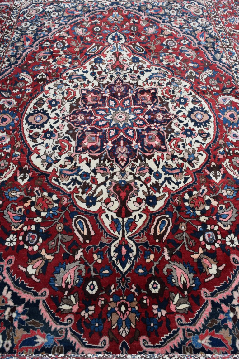 A Persian 'Bakhtiari' carpet, with large central floral medallion on a red floral field, - Image 6 of 8