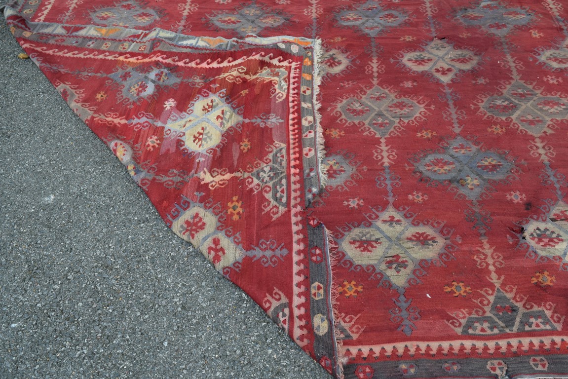 A large Turkish flat weave kelim carpet, with an all over geometric lattice design on a red field, - Image 9 of 10