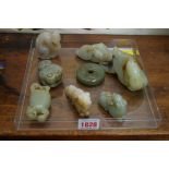 Eight Chinese carved jade items, largest 10.5cm wide.