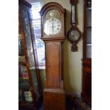 An oak 8 day longcase clock, the 12in arched dial inscribed 'Ts Farmer, Stockton', 205cm high,