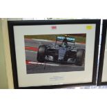 Formula One: a signed photograph of Nico Rosberg in Grand Prix car, 19.5 x 29.5cm.