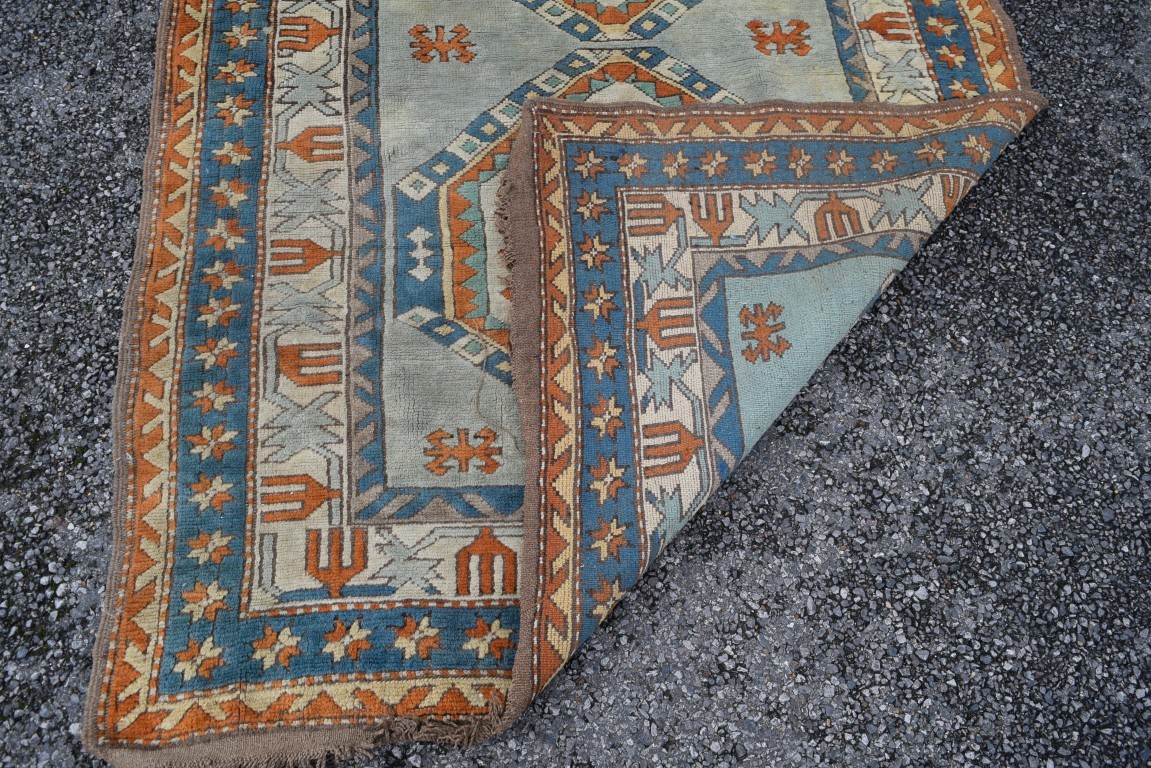 A Turkish Kars rug, with two large repeated geometric medallions and geometric design borders, - Image 7 of 8