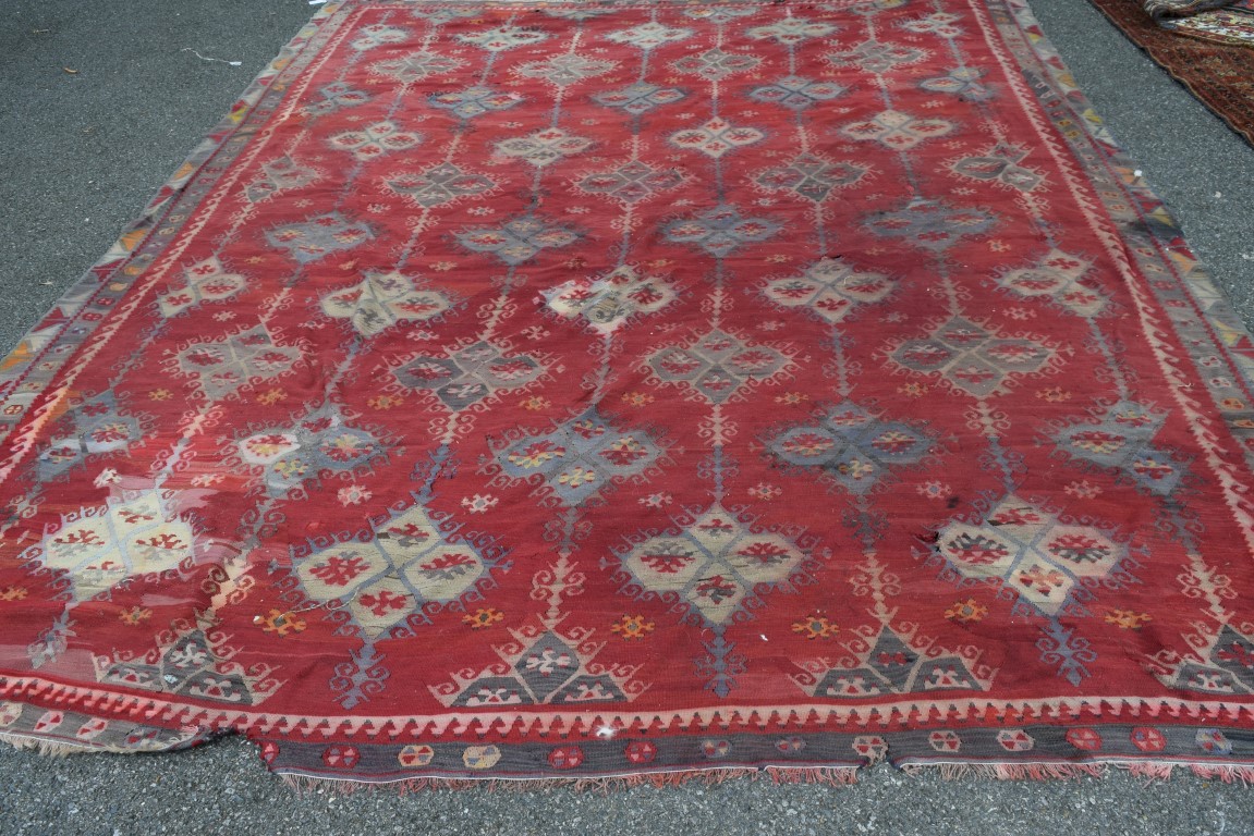 A large Turkish flat weave kelim carpet, with an all over geometric lattice design on a red field, - Image 4 of 10