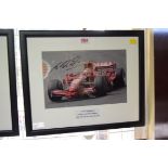 Formula One: a signed photograph of Michael Schumacher in Grand Prix car, 19.5 x 29.5cm.