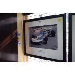 Formula One: a signed photograph of John Surtees in Grand Prix car, 19.5 x 29.5cm.