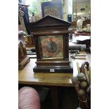 A late 19th century carved walnut architectural mantel clock, 41cm high.