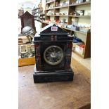 A late 19th century slate and marble mantel clock, 35cm high.