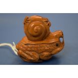 A Japanese carved wood netsuke figure group, of a toad, snail, spider and fly, 5cm high.