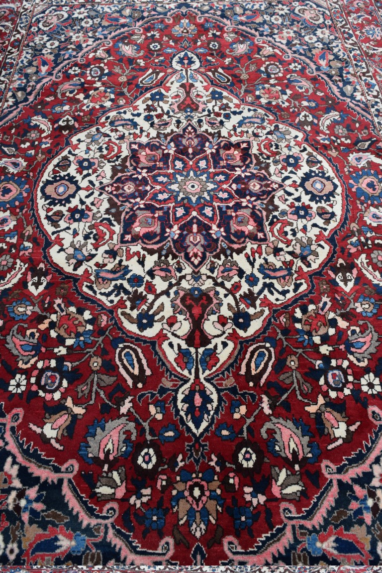 A Persian 'Bakhtiari' carpet, with large central floral medallion on a red floral field, - Image 5 of 8