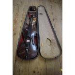 A late 19th/early 20th century Continental viola, with 15in back, in ebonized wood case.