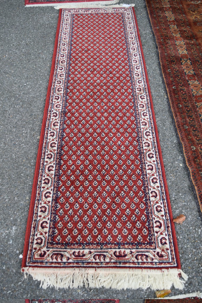 A narrow machine made runner, of Persian Hamadan design,