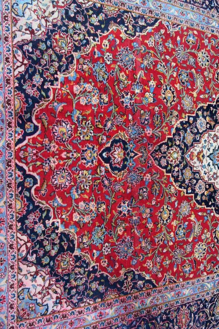 A Persian 'Kashan' carpet, with large coastal medallion on a floral red field, 352 x 251 cm. - Image 5 of 10