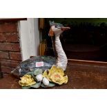 A pottery model of a Grebe, 24cm high, indistinctly signed to base.