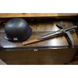 A German Third Reich Luftschutz combat helmet; together with a K98 bayonet and escape axe,