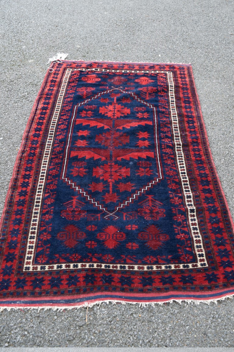 A Turkish 'Yagcibedir' rug, with large central medallion on a stylised floral blue field,