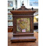 Two circa 1900 German carved oak mantel clocks, 36cm high.