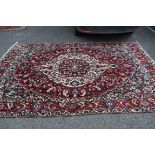 A Persian 'Bakhtiari' carpet, with large central floral medallion on a red floral field,