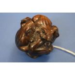 A Japanese carved wood large netsuke, in the form of a cluster of six frogs, 6cm diameter.