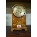 A circa 1900 walnut and inlaid dome top mantel clock, 24.5cm high.