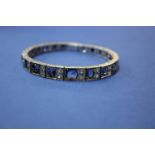 An unmarked bracelet set blue and white sapphires.