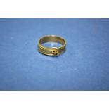 A 15ct gold buckle ring, 4g. Condition Report: Good overall, some minor surface scratching seen,