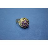 A '333' gold and amethyst ring.
