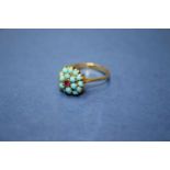 An 18ct gold turquoise and ruby ring. Condition Report: Good overall.
