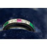 An unmarked eternity ring, set diamonds, rubies and emeralds.