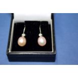 A pair of contemporary 18ct white gold earrings set diamond above pearl. Condition Report: Pearls