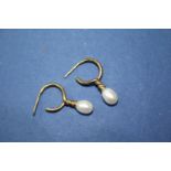 A 9ct gold bar brooch set single pearl; together with three various pairs of pearl earrings and;