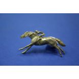 A 9ct gold horse and jockey brooch, 4cm, 6g.