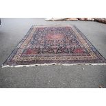 A large Persian Mashad carpet,