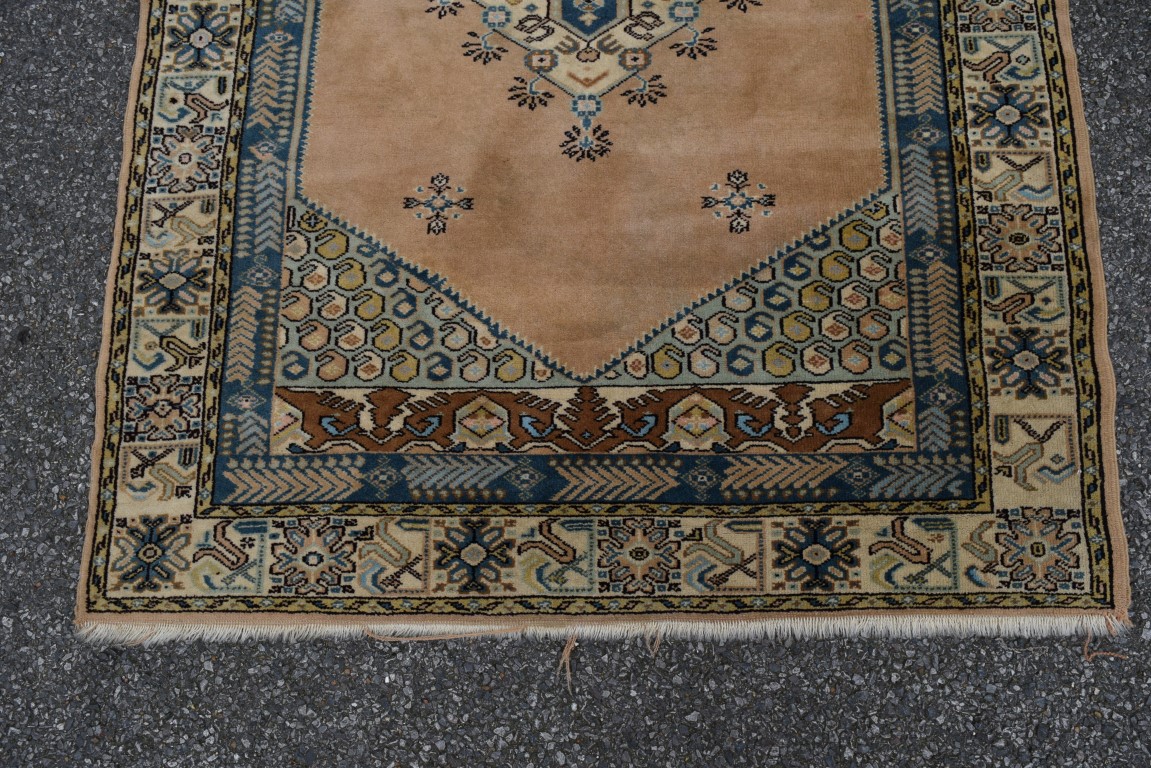 A Turkish rug, with central medallion on a salmon pink field, 150 x 115cm. - Image 3 of 4