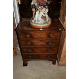 An old mahogany four drawer chest, 63cm wide.