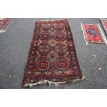 A Baluchi rug, with allover large Gul design, 190 x 100cm.