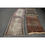 A Baluch rug together with a Persian Fars Tribal rug and two homespun rugs.