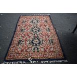 A Kashmiri chainstitch rug, with allover floral lattice field,