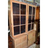 An antique pine bookcase, 135cm wide.