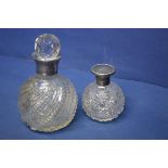 Two silver mounted scent decanters.