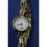 A vintage ladies 9ct gold wristwatch, on 9ct gold expanding bracelet.