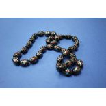 An inlaid tortoiseshell prayer bead necklace. Condition Report: weight 40.