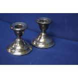 A pair of silver dwarf candlesticks, London 1920, 7cm.