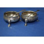 A pair of Victorian silver salts, by Saul Scott; together with two unmatched salt spoons.