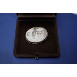 A 9ct gold mounted oval cameo, depicting farmyard scene.