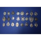 A collection of fifty four 19th and 20th century silver, enamel and metal sporting medals.